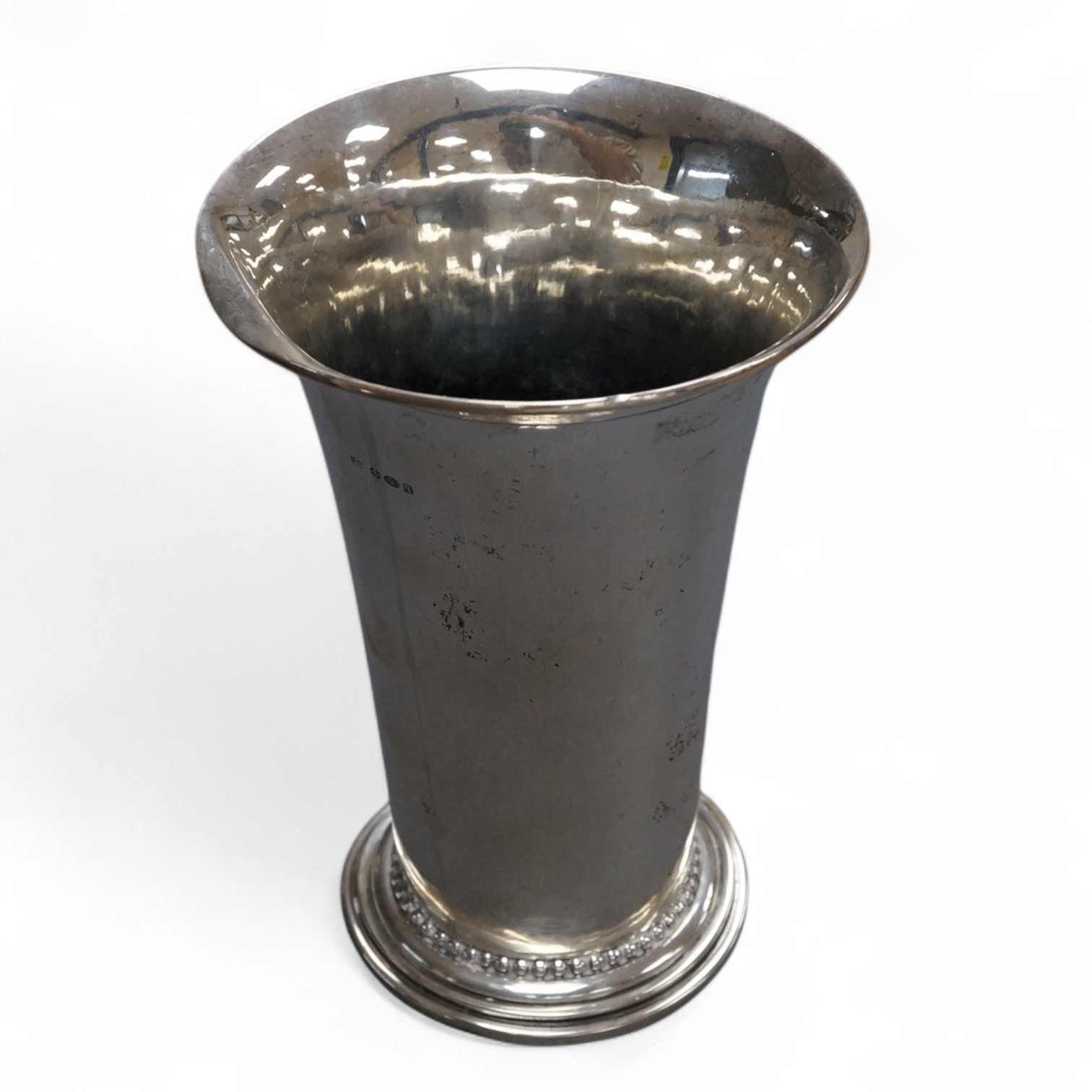 A Georg Jensen sterling 925 beaker, with flared rim and engraved inscription 'The Bookies Cup, 1933' design no.107A, 1925-1932 mark, import marks for George Stockwell, London, 1931, height 13.5cm, 174 grams (a,f,).